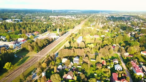 drone capturing clustered settlement in sigulda suburb to train station in estonia