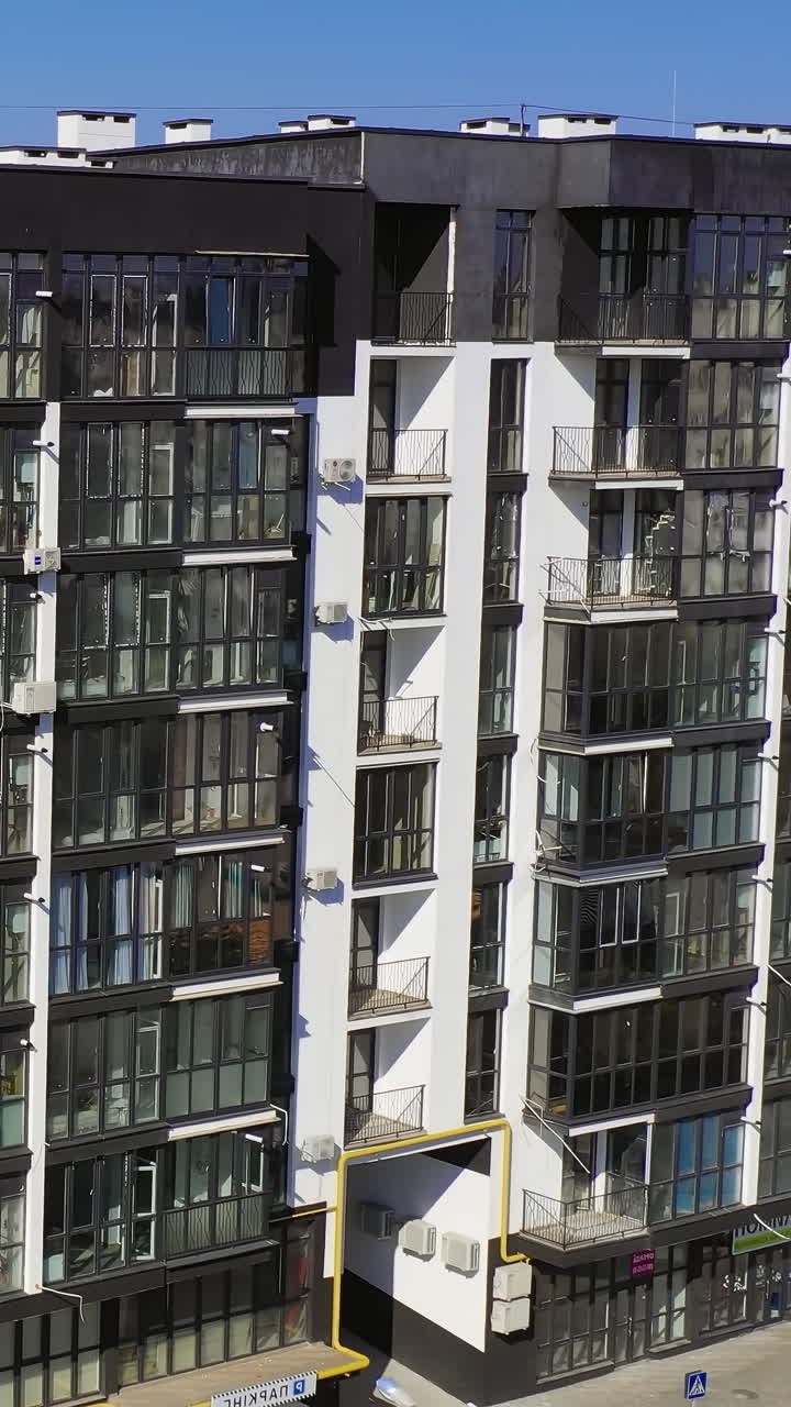 Drone aerial footage of buildings. Aerial view of apartment blocks in city