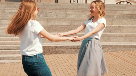 two girls playing and having fun outdoors