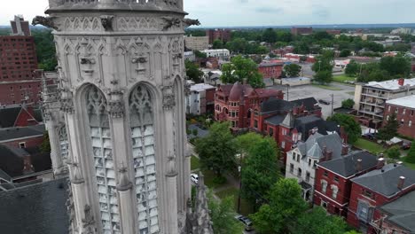 historic church with victorian houses and homes across the street