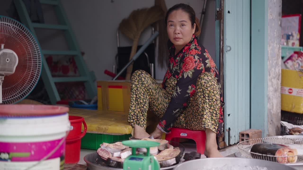 Fishmonger Preparing Fish at a Street Market