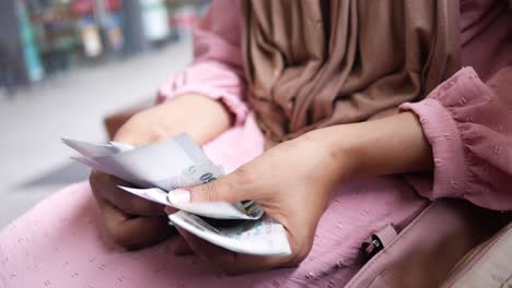 woman holding money