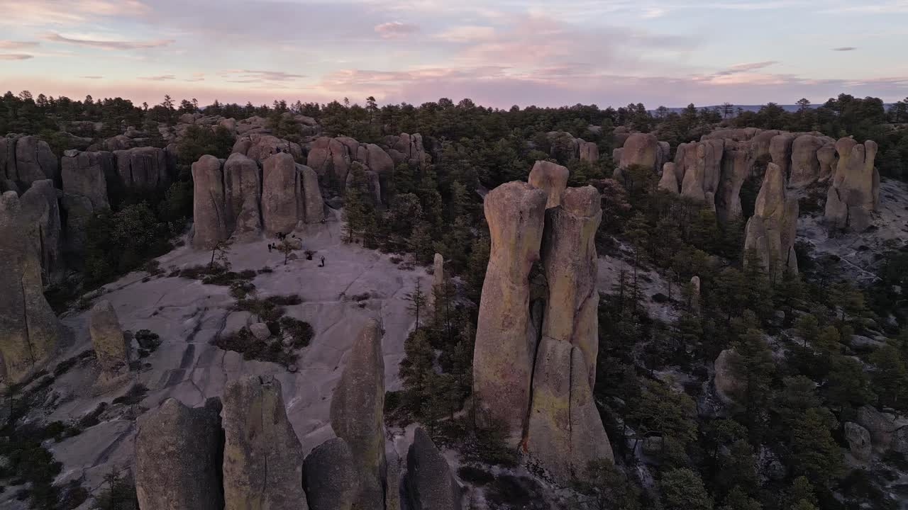 Rock formations and forest landscape at Valle de los Monjes, Chihuahua at sunset