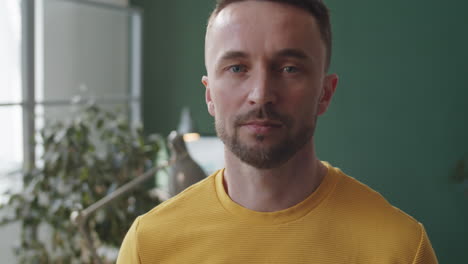 portrait of handsome caucasian man in office