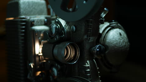 moody close up of an old 8mm projector, shallow depth of field and high contrast