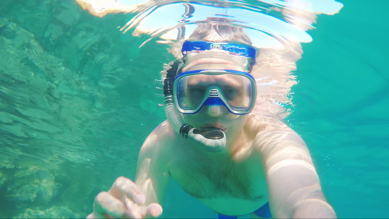 Diver Makes Selfie Waving At The Camera - Underwater