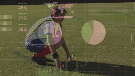 Animation-of-financial-data-processing-over-caucasian-female-football-player-on-field