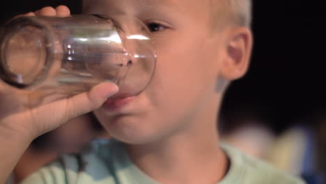 Child-drinking-water-outdoor