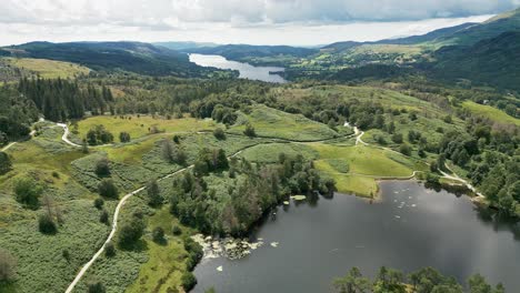 drone aerial video of tarn hows lake district national park england uk on a beautiful sunny summer day