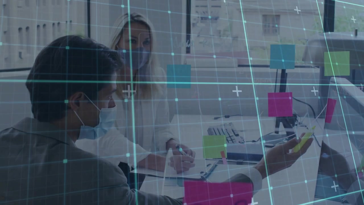 Man picking smartphone showing content to woman for notes in office AR grid highlighting monitor