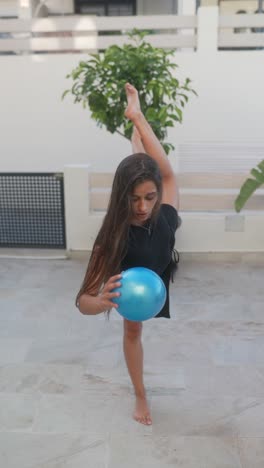 woman performing yoga/dance poses outdoors