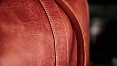 Details-of-a-hand-crafted-caramel-leather-bag-with-neat-stitching