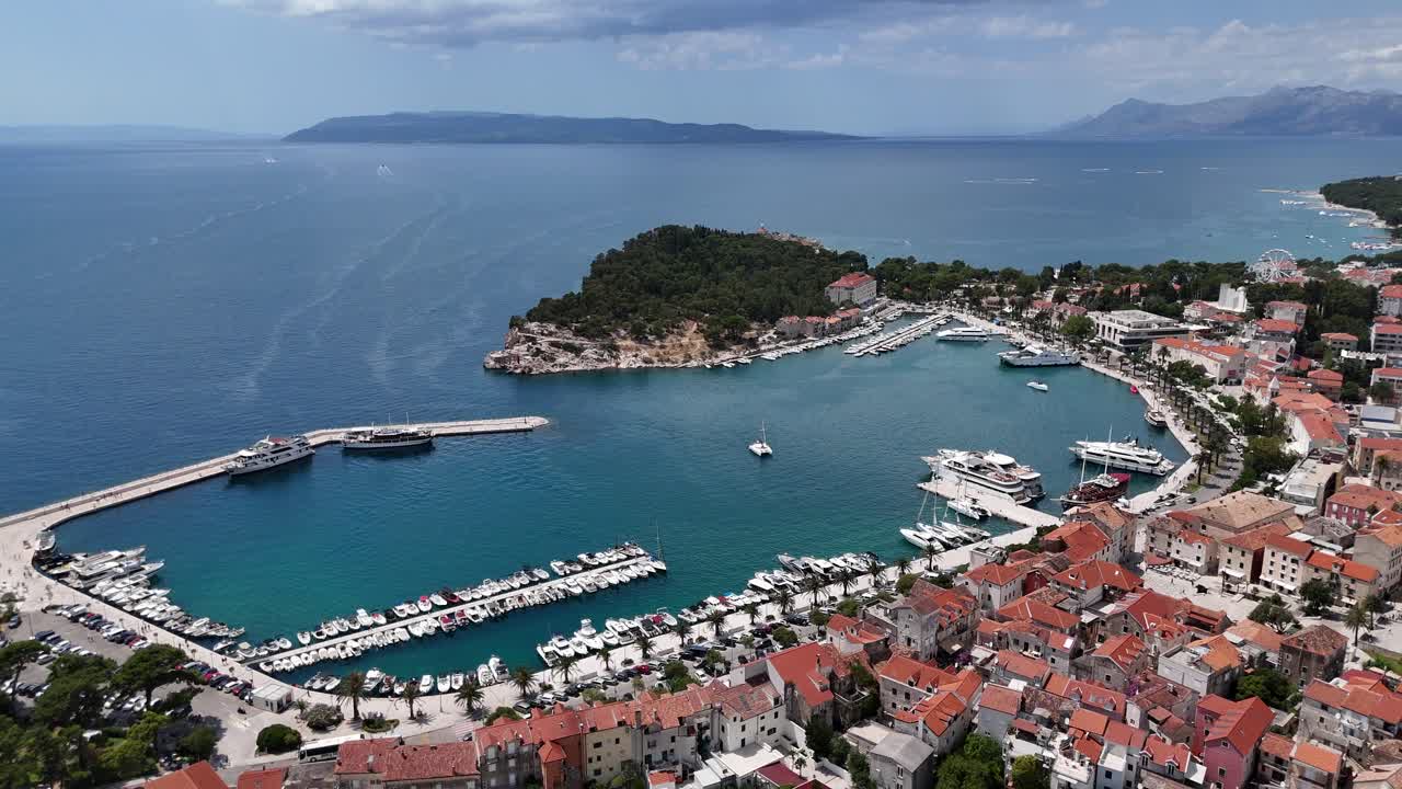 Drone aerial view of makarska harbour town city croatia balkan country balkans Biokovo mountains