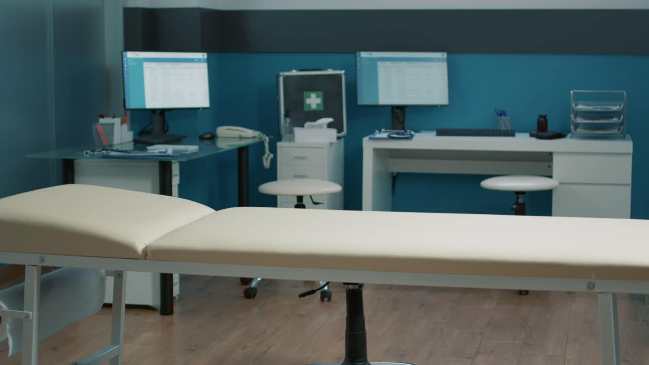 Interior of a doctor's office with examination table and medical equipment