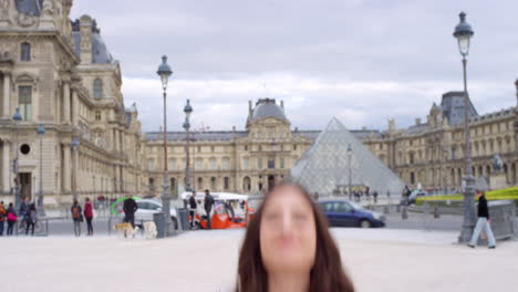 happy woman in paris at the louvre museum