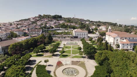 empty municipal garden and episcopal palace in background, castelo branco in portugal