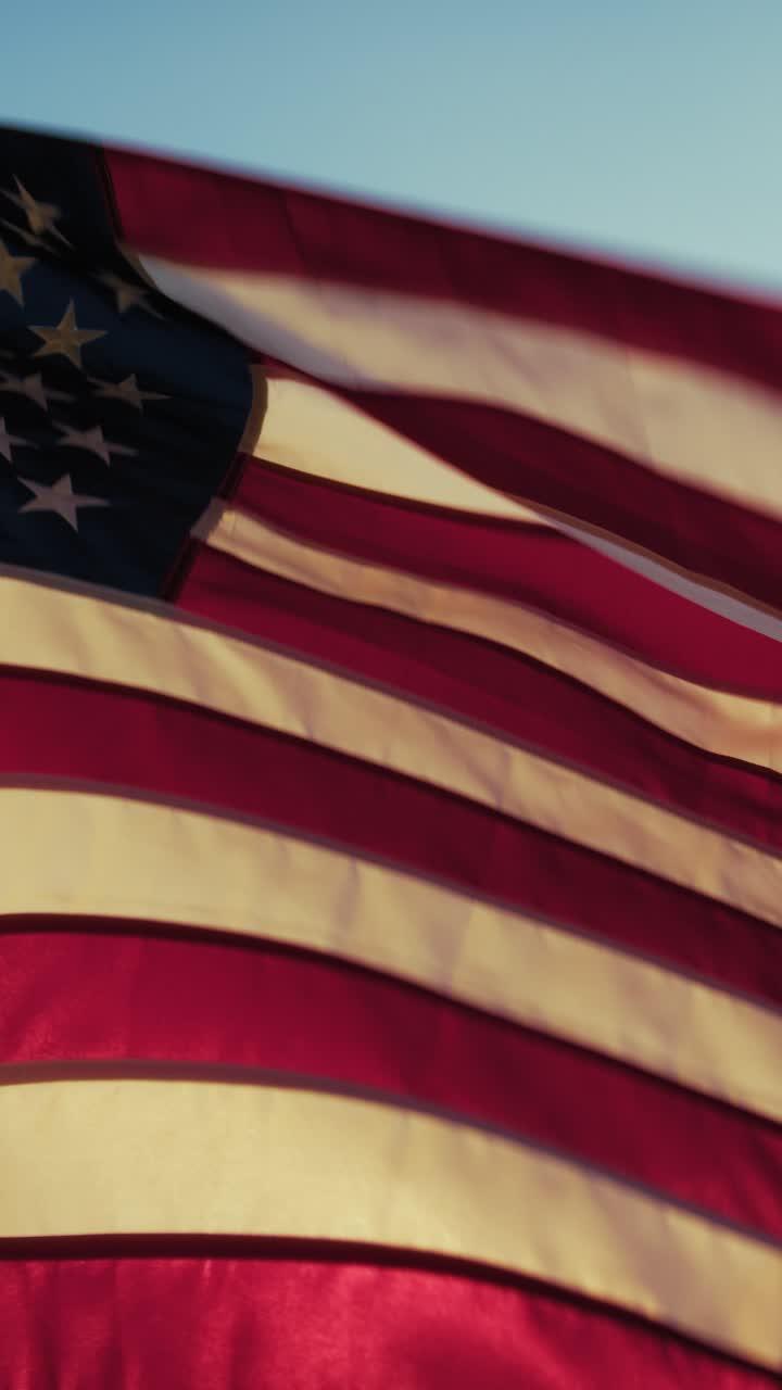 American Flag Waving At Sunset Sky On Memorial Day Holiday