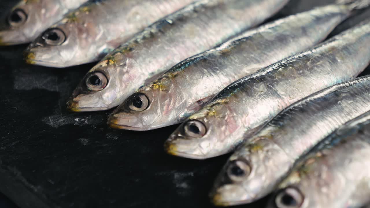 Fresh Sardines on a Dark Surface