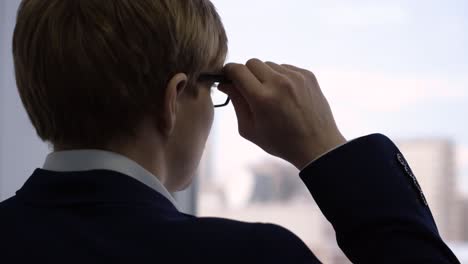 businessman looking out the window