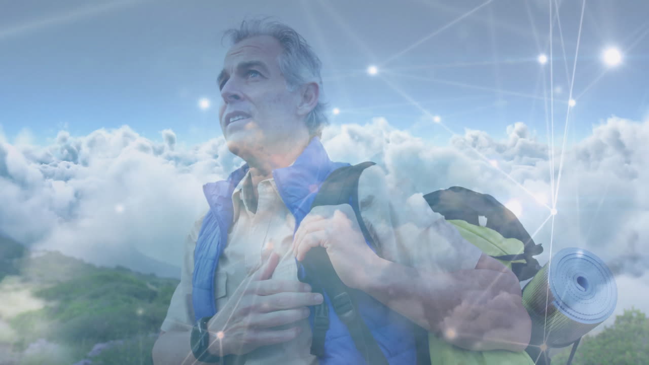 man hiking mountain trail, showcasing digital network overlay connecting nature and technology