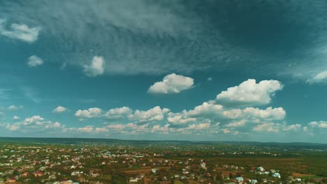 dramatic drone motion over landscape with dark sky before rain.