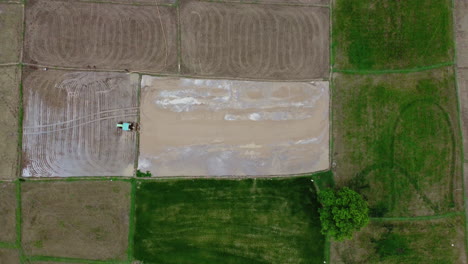 Tractor-Plowing-Paddy-Field-Before-Planting-Rice