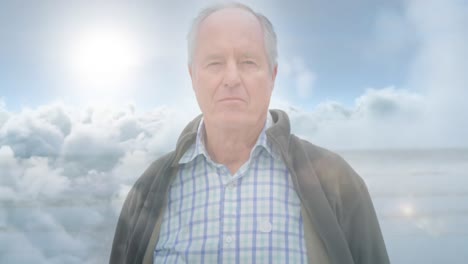 animation of glowing light over serious senior man over clouds