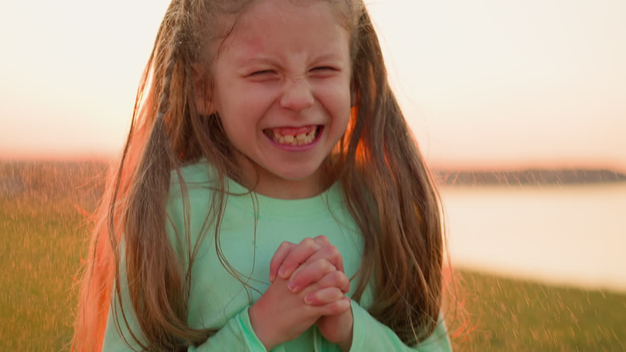 Girl finds joy among storm on riverbank child energy boundless with joy radiating outwards like