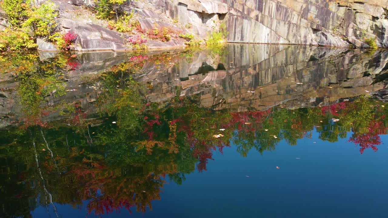 La V&eacute;rendrye Wildlife Reserve, aerial footage of pond near autumn forest