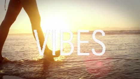 animation of text vibes over people by seaside