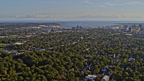 New-Haven-Connecticut-Aerial-v22-pan-shot-of-beautiful-nature-landscape-across-fair-haven-and-east-rock-neighborhoods,-overlooking-at-distance-cityscape---Shot-with-Inspire-2,-X7-camera---October-2021