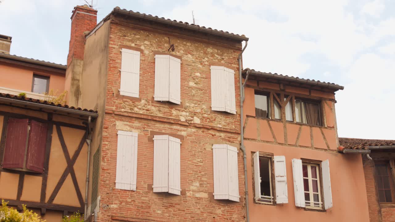 The Brick Facade Of The Saint-Salvy Cloister Square In The Old Town Of Albi, France. Low Angle Shot