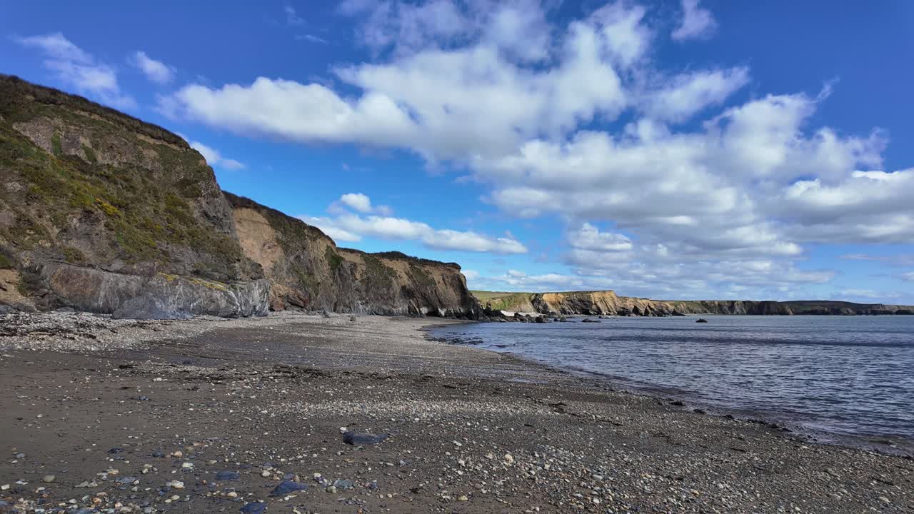 Timelapse dramatic clouds move over Copper Coast Beach at Boatstrand Waterford Ireland