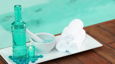 Beauty-treatment-in-bowl-presented-on-plate-with-glass-bottle