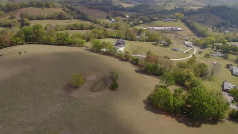 Aerial-orbit-over-Tennesee-rural-landscape-with-fields-and-farms-in-early-autumn