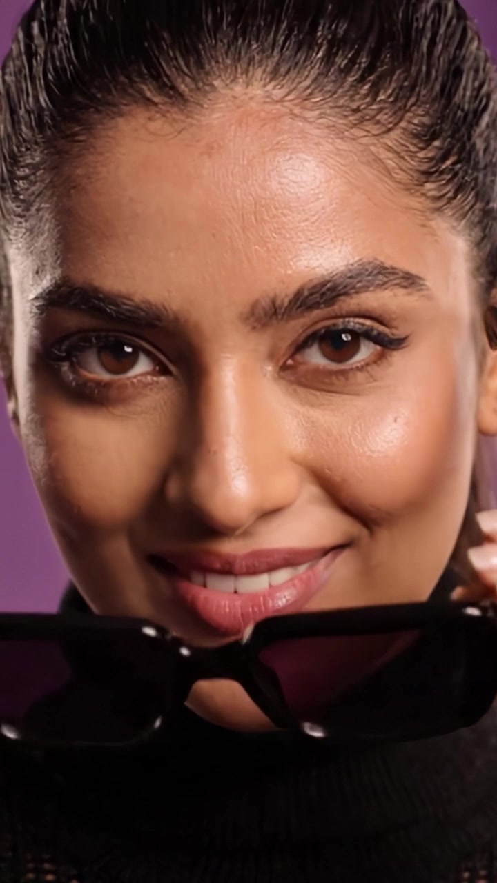 A Stylish Sequence Featuring a Confident Individual Showcasing Fashionable Sunglasses and Emphasizing Their Unique Beauty in an Engaging Setting