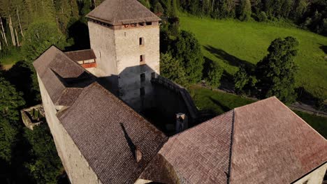 medieval kaprun castle in austrian alps, state of salzburg - drone descending