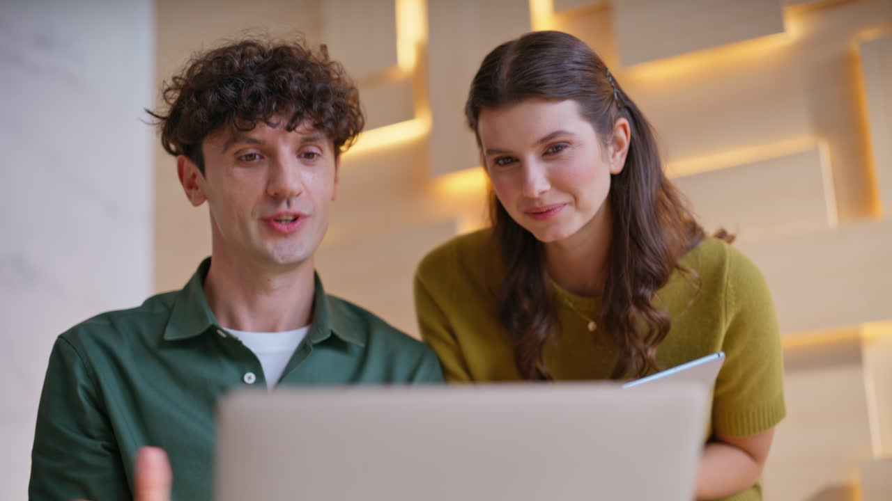 Team Collaborating on Laptop