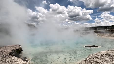 tourist pov of excelsior geyser crater (famous hot springs pool) in yellowstone national park.