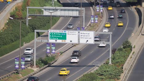 Traffic on a highway with road signs