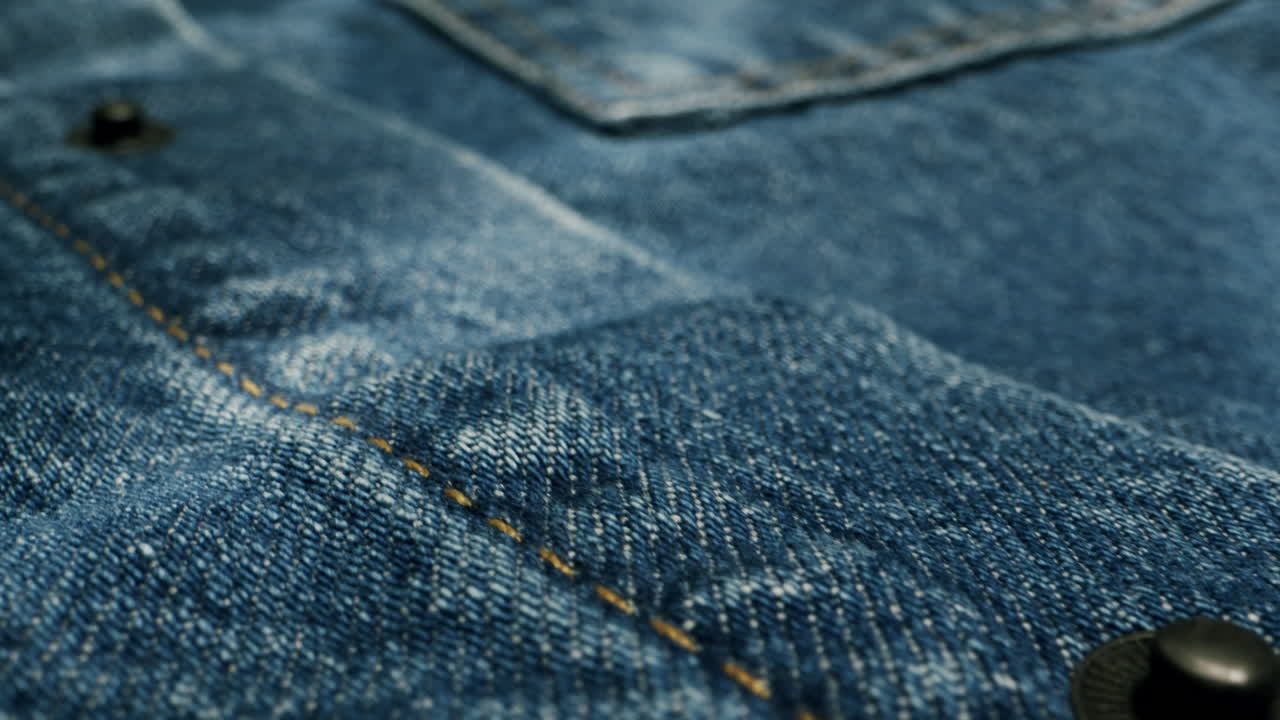 Blue textile jeans cloth texture close-up macro. Fashion fabric multicolor. Cotton casual clothes