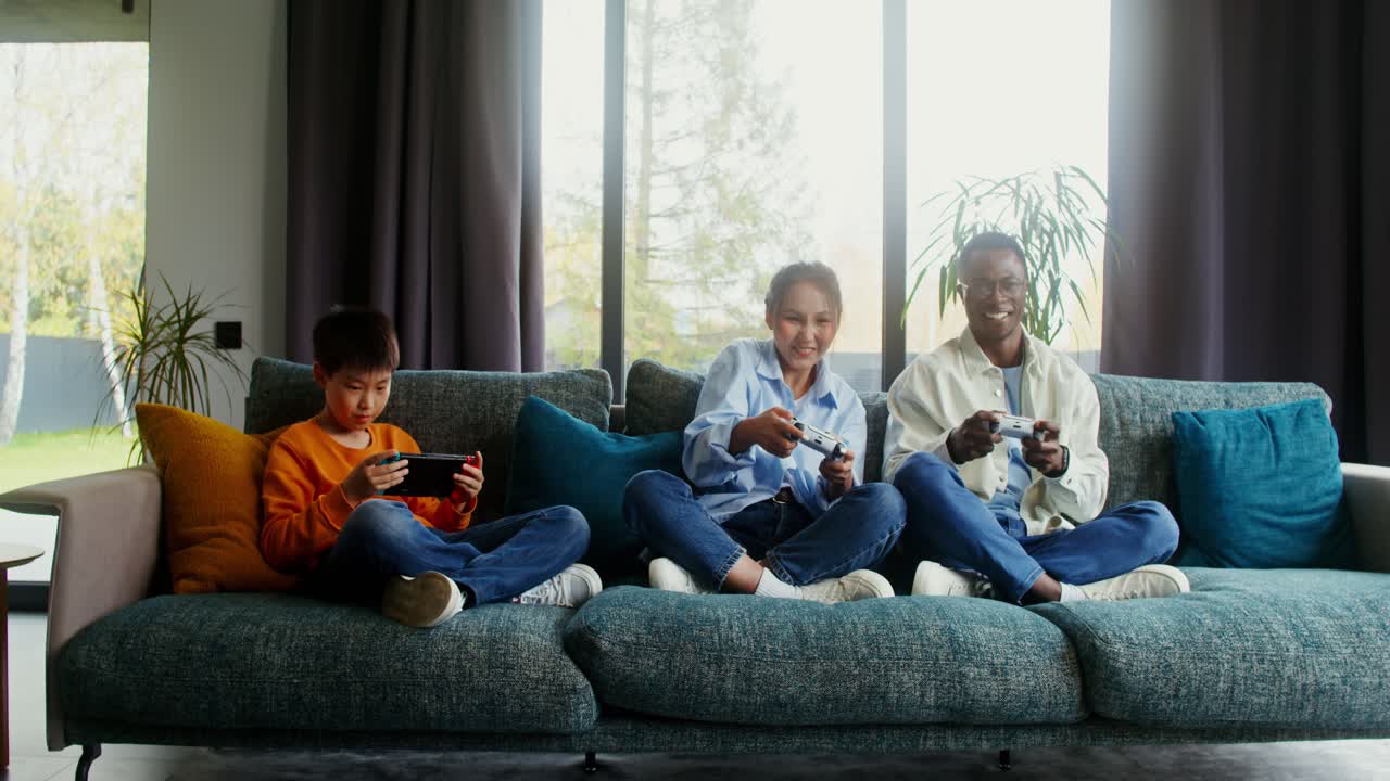 Family Playing Video Games Together on Couch