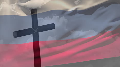 silhouette of cross against cloudy sky and russian flag in background