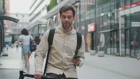 man sitting on bike and texting