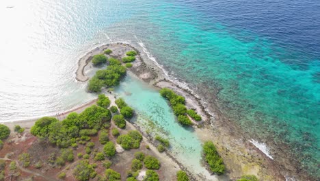 aerial establishing view of doggy beach clear turquoise caribbean waters by jan thiel and zanzibar, curacao