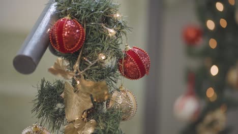 Christmas-Light-Decorations-Sparkling-on-Stairs,-Garland-Ornaments-with-Bokeh,-Close-Up,-Natural-Light