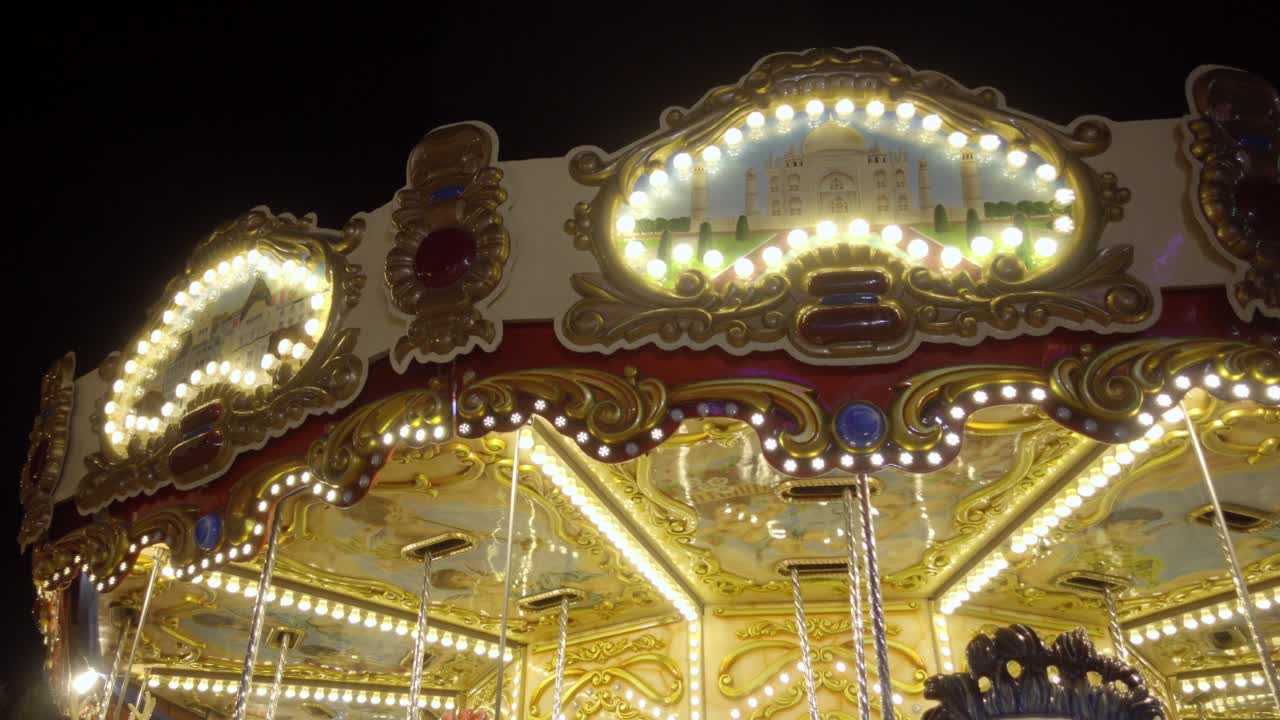 Brightly lit carousel at Cholula festival, night time magical vibe