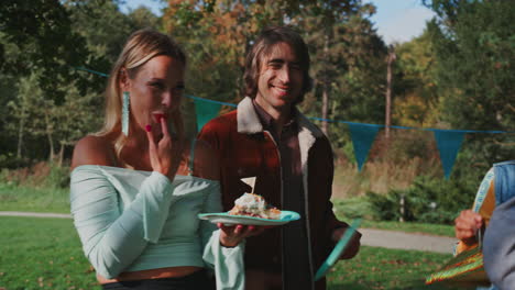friends celebrating in a park