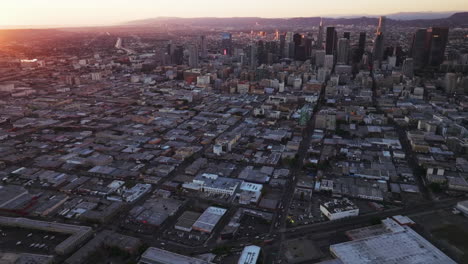panoramic aerial view of a sprawling city at sunset