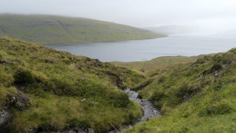sorvagsvatn lake in fog on vagar island, faroes islands. wide shot